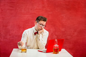 Image showing Young funny man with laptop at St. Valentine\'s Day