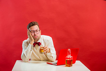 Image showing Young funny man with laptop at St. Valentine\'s Day