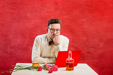 Image showing Young funny man with flowers