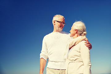 Image showing happy senior couple talking outdoors