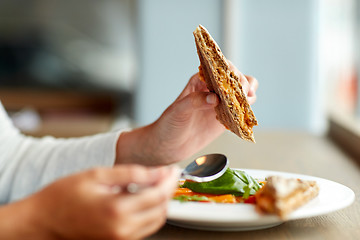 Image showing woman eating gazpacho soup at restaurant