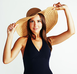 Image showing young pretty brunette woman wearing summer hat and swimsuit isolated on white background