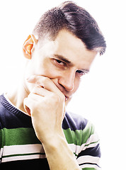 Image showing Portrait of a smart serious young man standing against white background. Emotional concept for gesture