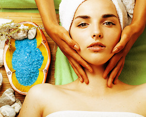 Image showing stock photo attractive lady getting spa treatment in salon, close up asian hands on face