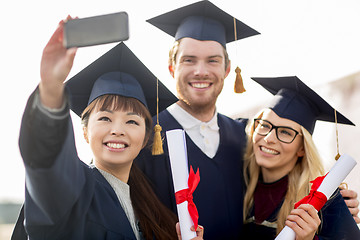 Image showing students or bachelors taking selfie by smartphone