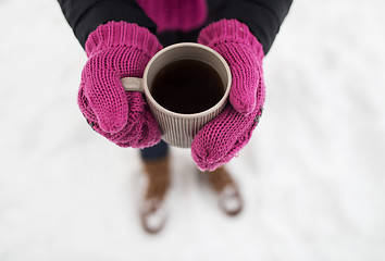 Image showing close up of woman with tea mug outdoors in winter