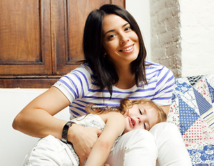 Image showing Portrait of mother and daughter playing in bed, lifestyle people concept