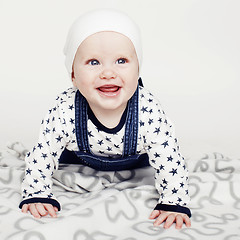 Image showing little cute baby toddler on carpet isolated close up smiling, lifestyle people concept