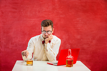 Image showing Young funny man with laptop at St. Valentine\'s Day