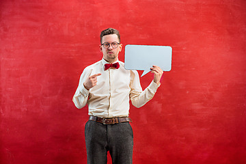 Image showing Young funny man with empty blank sign