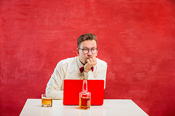 Image showing Young funny man with laptop at St. Valentine\'s Day