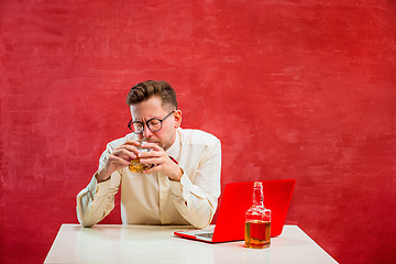 Image showing Young funny man with laptop at St. Valentine\'s Day