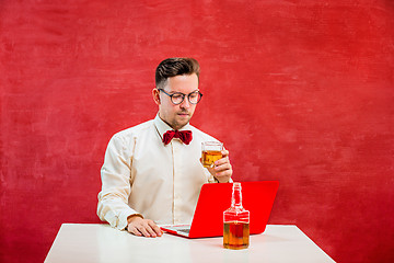 Image showing Young funny man with laptop at St. Valentine\'s Day