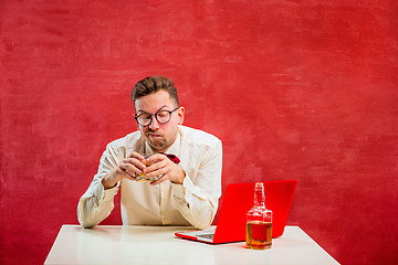 Image showing Young funny man with laptop at St. Valentine\'s Day