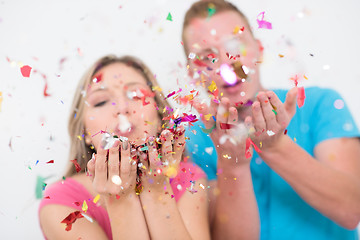 Image showing romantic young  couple celebrating  party with confetti