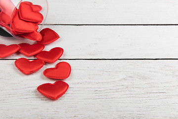 Image showing Red hearts on a white wood background