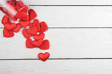 Image showing Red hearts on a white wood background