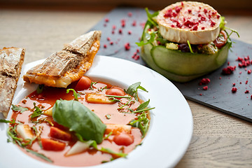 Image showing goat cheese salad and gazpacho soup at restaurant