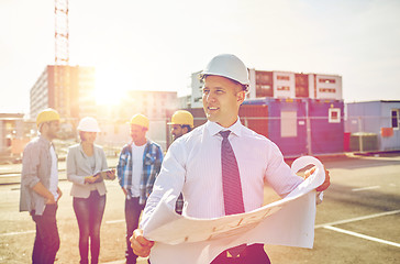 Image showing architect with blueprint on construction site