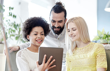 Image showing happy creative team with tablet pc in office