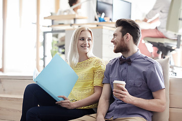 Image showing office workers with folder and coffee