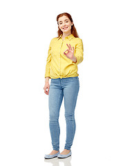 Image showing happy young woman showing ok hand sign