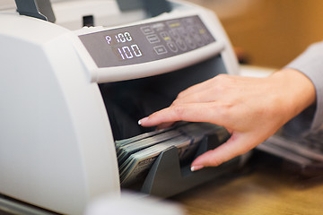 Image showing dollars in electronic money counter at bank office