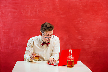 Image showing Young funny man with laptop at St. Valentine\'s Day