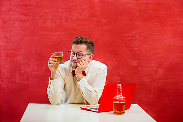 Image showing Young funny man with laptop at St. Valentine\'s Day