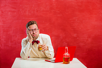 Image showing Young funny man with laptop at St. Valentine\'s Day