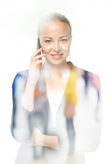 Image showing Portrait of beautiful young caucasian woman using mobile phone.