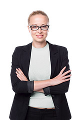 Image showing Business woman standing with arms crossed against white background..