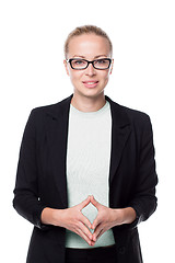 Image showing Business woman standing with arms crossed against white background..