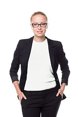 Image showing Business woman standing with arms crossed against white background..