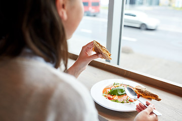 Image showing woman eating gazpacho soup at restaurant