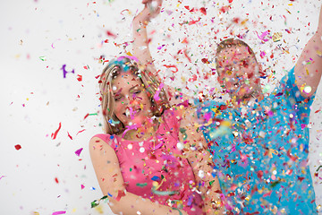 Image showing romantic young  couple celebrating  party with confetti