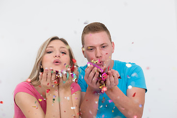 Image showing romantic young  couple celebrating  party with confetti