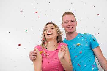 Image showing romantic young  couple celebrating  party with confetti