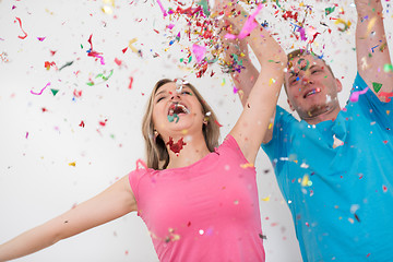 Image showing romantic young  couple celebrating  party with confetti