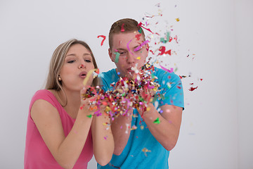 Image showing romantic young  couple celebrating  party with confetti