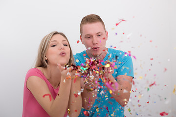 Image showing romantic young  couple celebrating  party with confetti