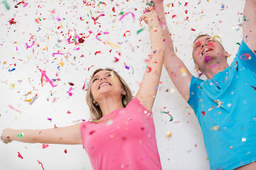 Image showing romantic young  couple celebrating  party with confetti