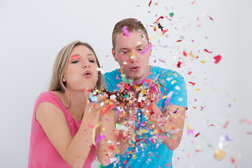 Image showing romantic young  couple celebrating  party with confetti