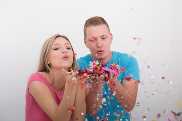 Image showing romantic young  couple celebrating  party with confetti