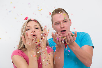 Image showing romantic young  couple celebrating  party with confetti