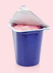 Image showing fresh pink berry yogurt in blue plastic pot