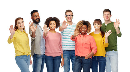 Image showing international group of happy people waving hand