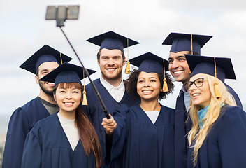 Image showing students or bachelors taking selfie by smartphone