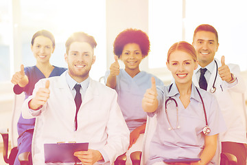 Image showing group of happy doctors on seminar at hospital