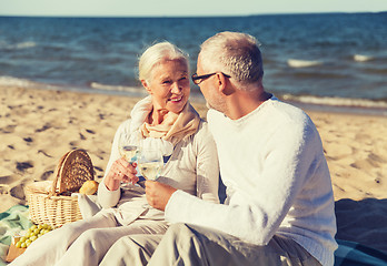 Image showing happy senior couple talking on summer beach